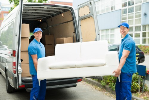 Man and van vehicle loading furniture in Mayfair near elegant townhouses