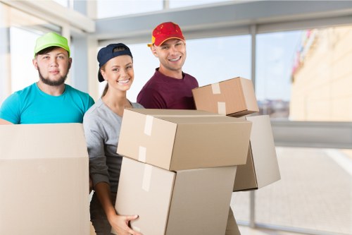 Furniture removal team handling a move in a Mayfair street