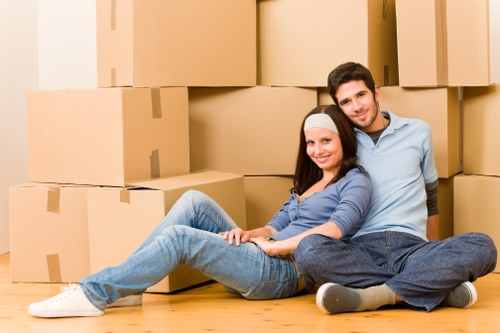 Packed moving boxes and protected furniture ready for removals in a Mayfair apartment