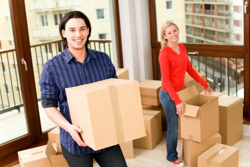 Packed household boxes and wrapped furniture ready for relocation in Mayfair